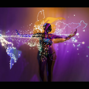 Fine Art Photography by PVR (Pamela Vasquez Rodriguez). “Sunset Adoch” is a piece from the Invisible Borders-Lines collection. A black woman with her arms open horizontally, a map of the world projected over her in purple and yellow background.